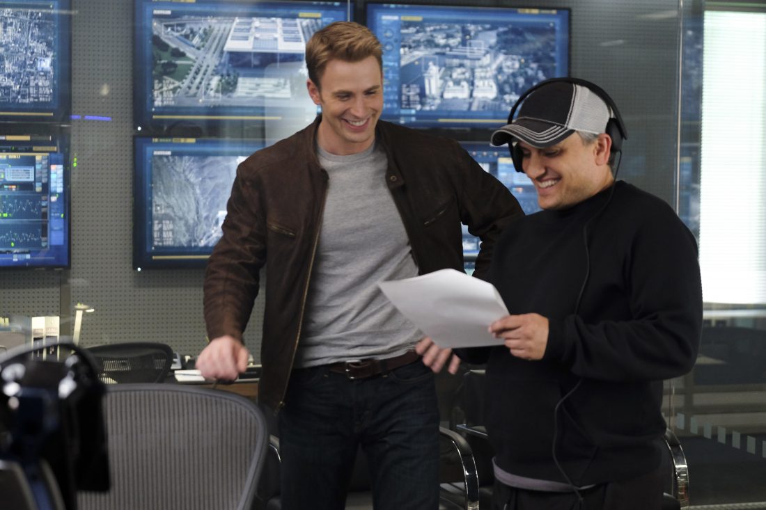 Captain America: Civil War L to R: Chris Evans (Captain America) on set w/ Director Joe Russo Ph: Zade Rosenthal ©Marvel 2016