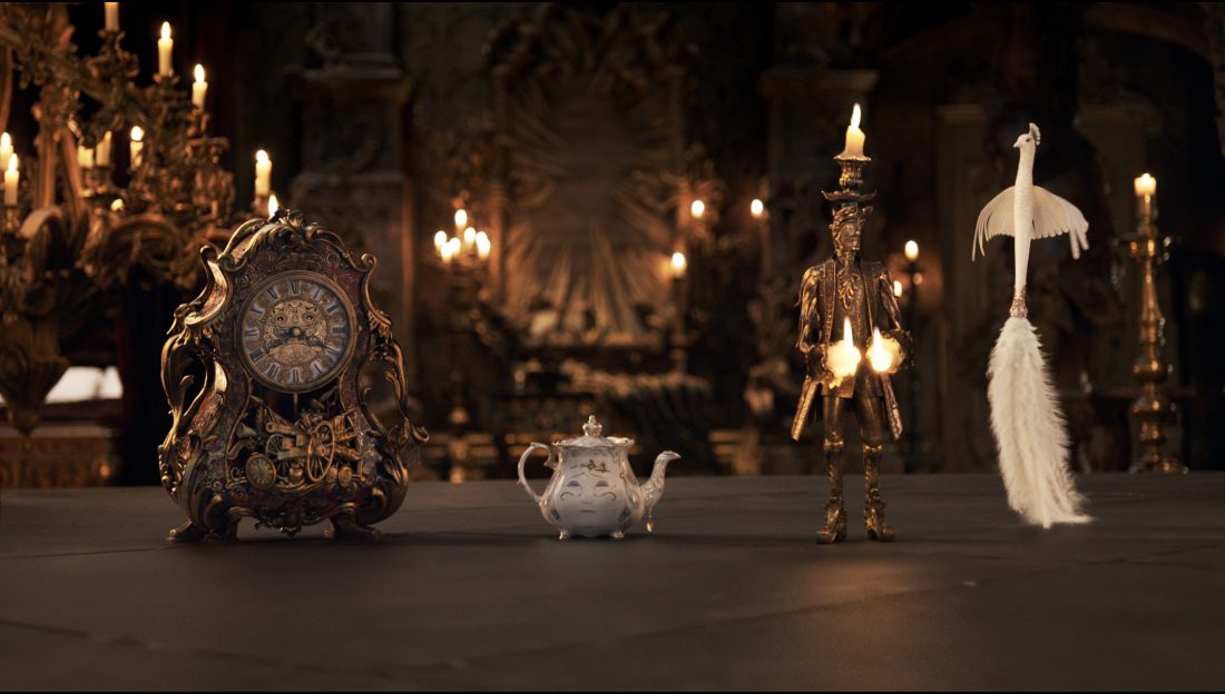 The mantel clock Cogsworth, the teapot Mrs. Potts, Lumiere the candelabra and the feather duster Plumette live in an enchanted castle in Disney's BEAUTY AND THE BEAST the live-action adaptation of the studio's animated classic directed by Bill Condon.